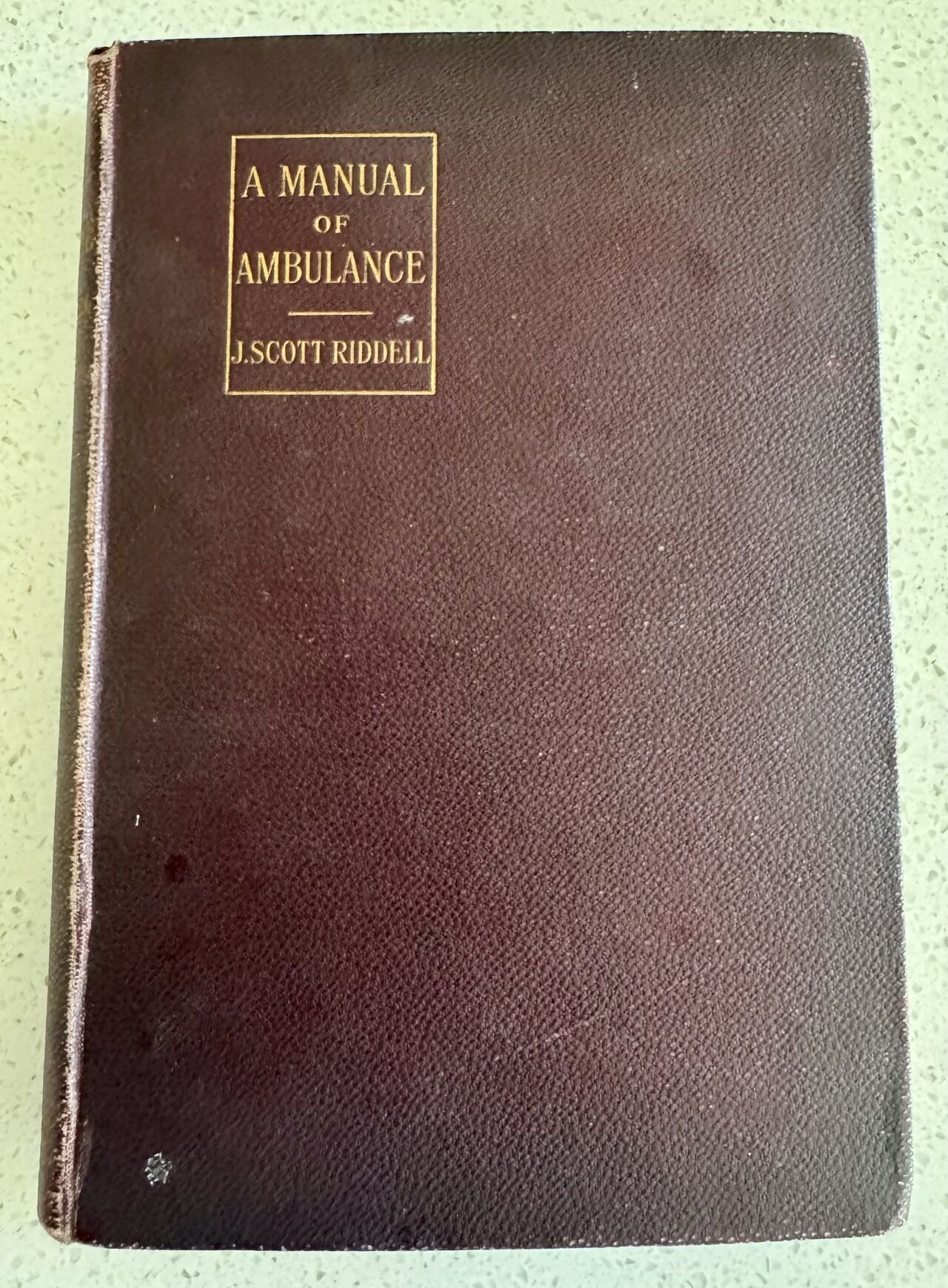 Original cloth-bound cover of A Manual of Ambulance by J. Scott Riddell