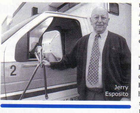 Portrait of Jerry Esposito beside an ambulance